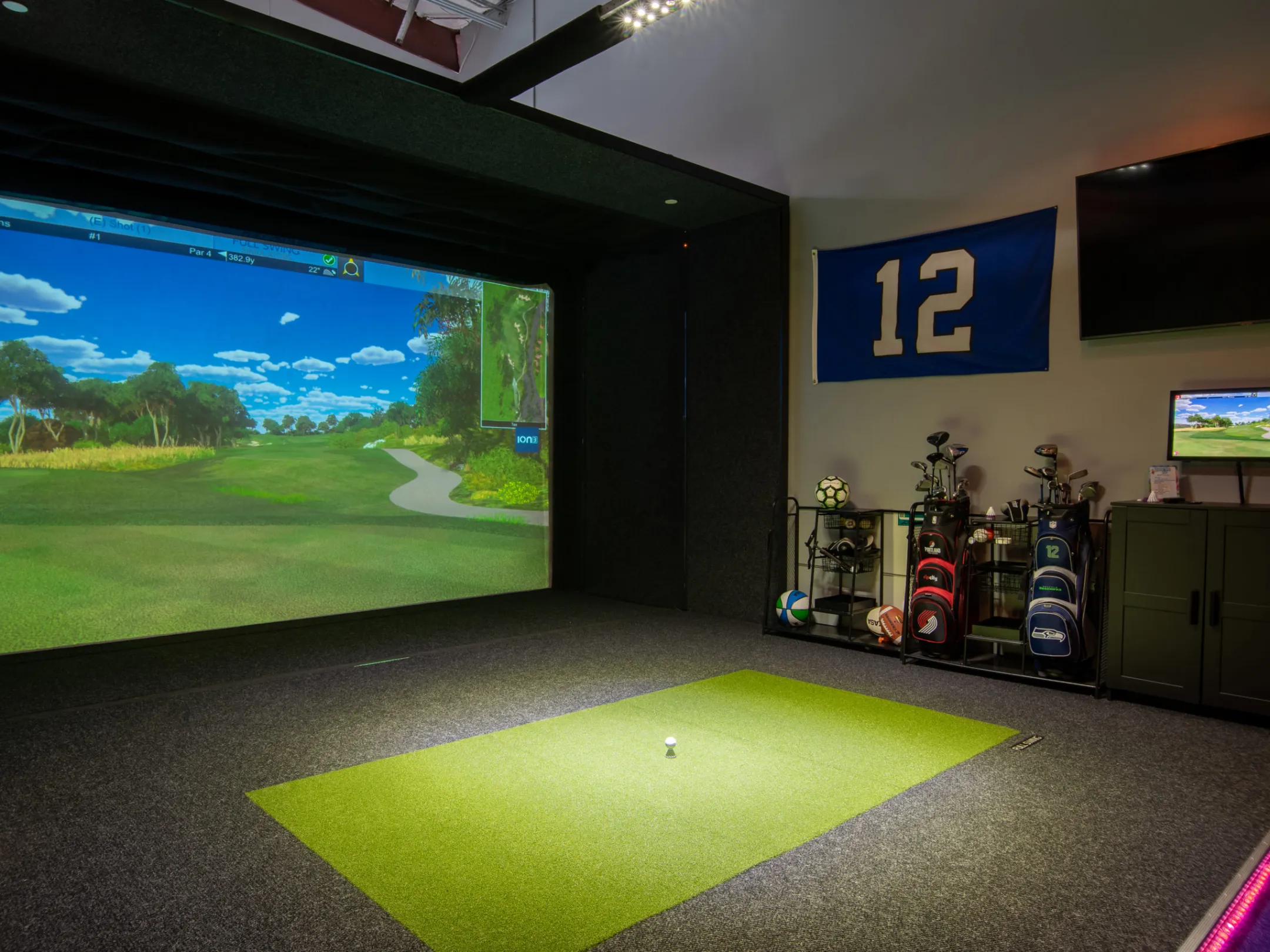 A shot of a golf simulator screen on a golf course.