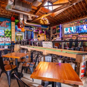 Shuffle board table in mini golf bar