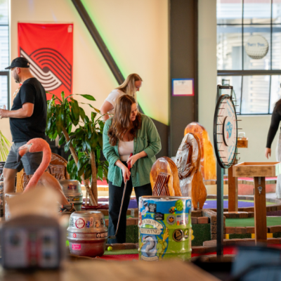 Group of people playing mini golf