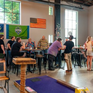 a group of people sitting at a table in a room